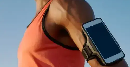Man-in-sports-gear-with-mobile-on-arm-1