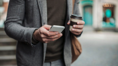 A man is watching his mobile phone concept