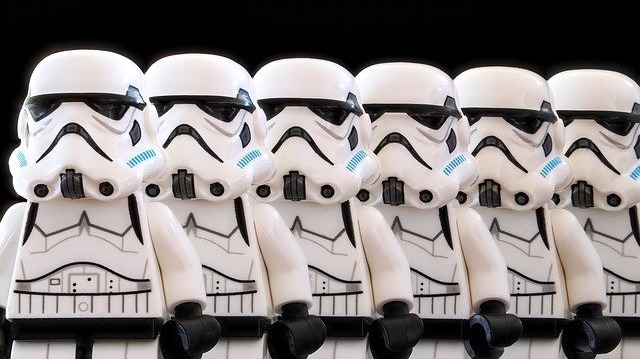 Clone concept; row of Lego stormtrooper figures against black background