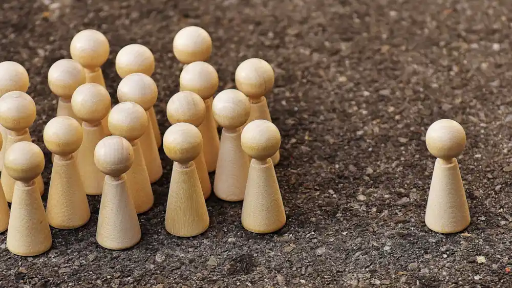 Group of people represented by wooden figures