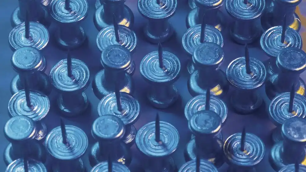 Close up of safety pins with blue filter