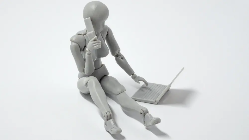 A woman robot using a computer to pose as a human being.