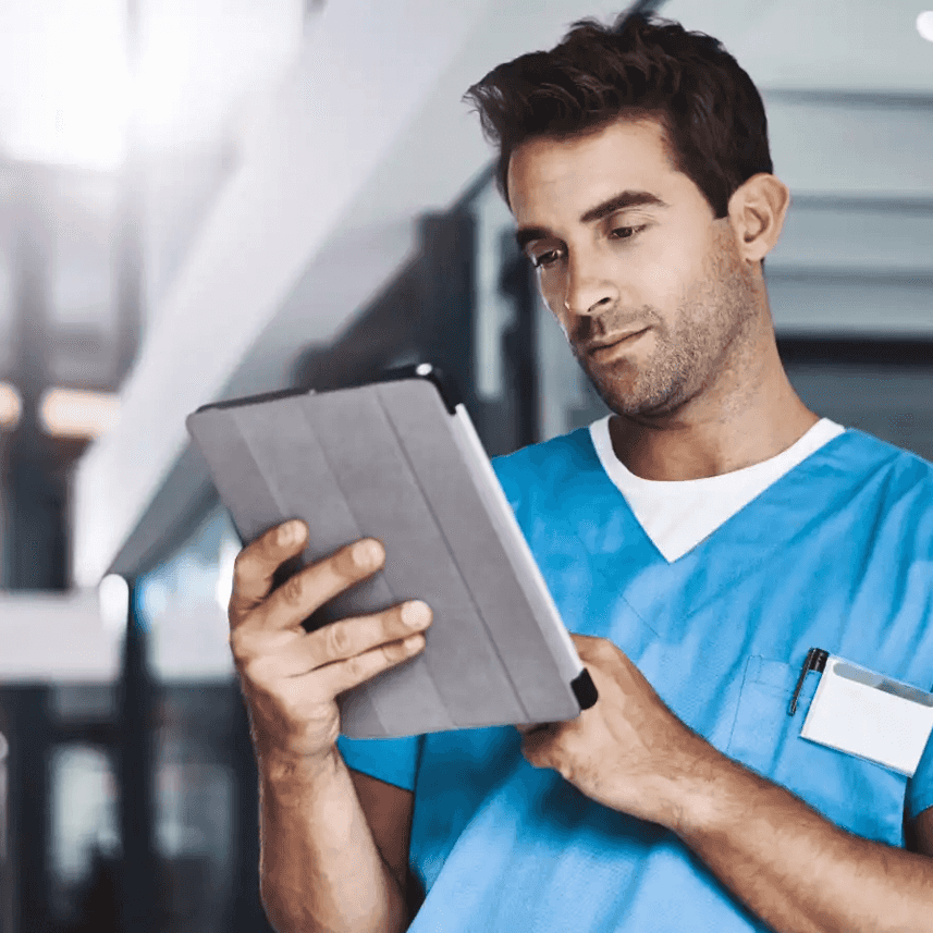 Medical professional looking at a tablet