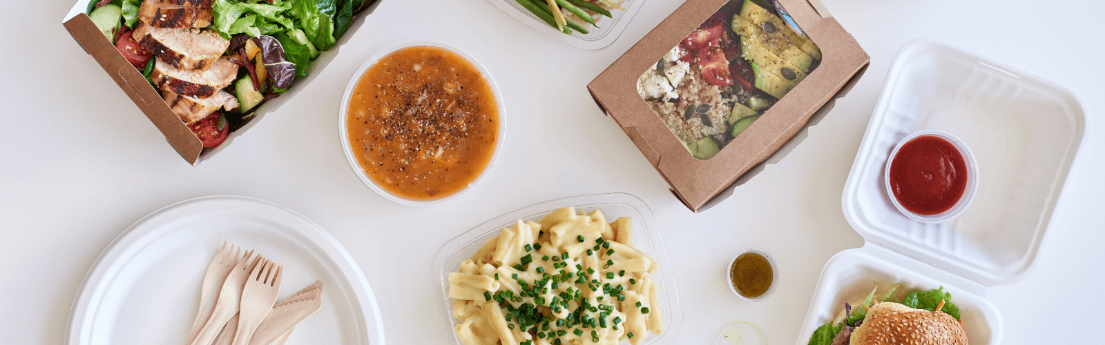 election of boxed take-out food on a white table